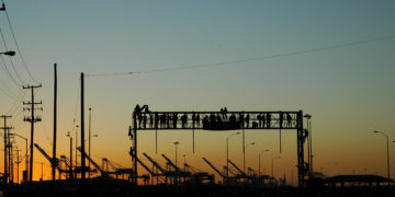 People climb scaffolding at Occupy/Decolonize Oakland