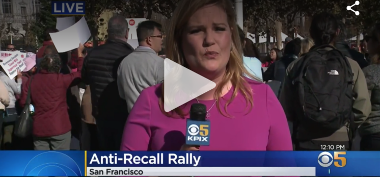 Screenshot of newscaster with blonde hair and a microphone; text on-screen has CBS logo, "Anti-Recall Rally," and "San Francisco" at the bottom
